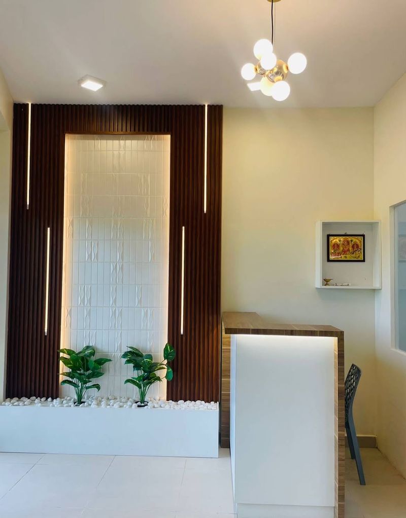Reception desk with wooden slat wall and indoor plants