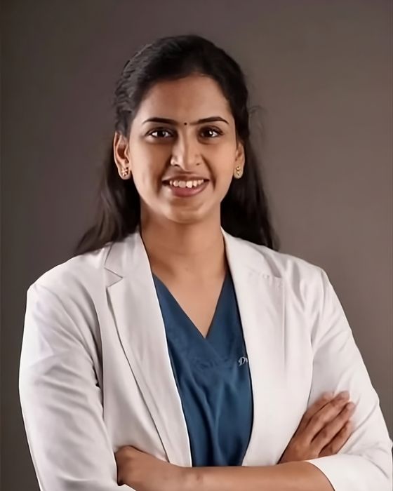 Portrait of Dr. Raja Rajeshwari in a white coat